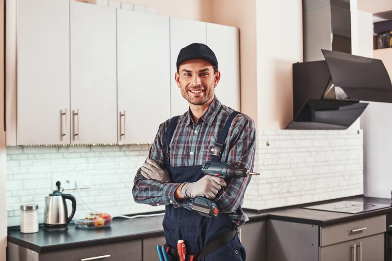 crm for home service contractor  - modern-handyman-portrait-of-a-smiling
